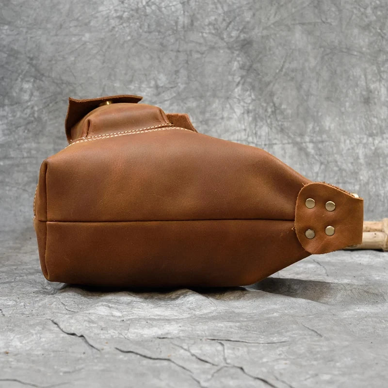 vintage light brown leather bag highlighting stitching - bottom view.