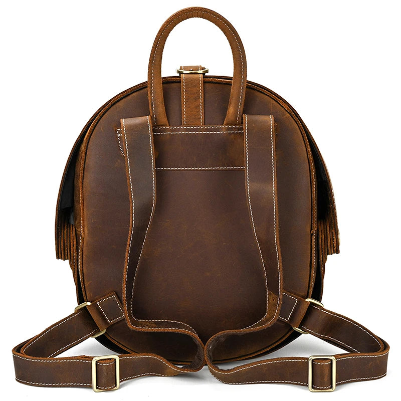 Back view of a brown leather backpack with adjustable straps and elegant handle.