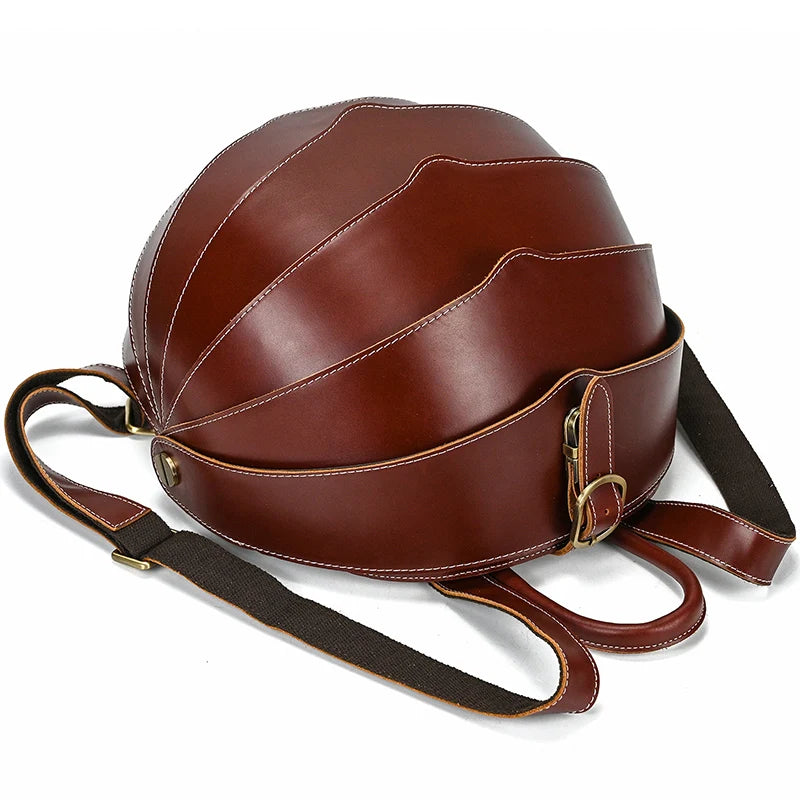 Brown tone leather backpack with an exclusive wavy design, highlighting its elegant stitching and rounded shape.