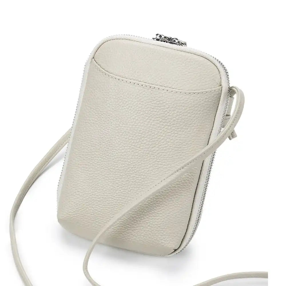 Stylish white leather crossbody bag with a sleek design and leather strap - front view.