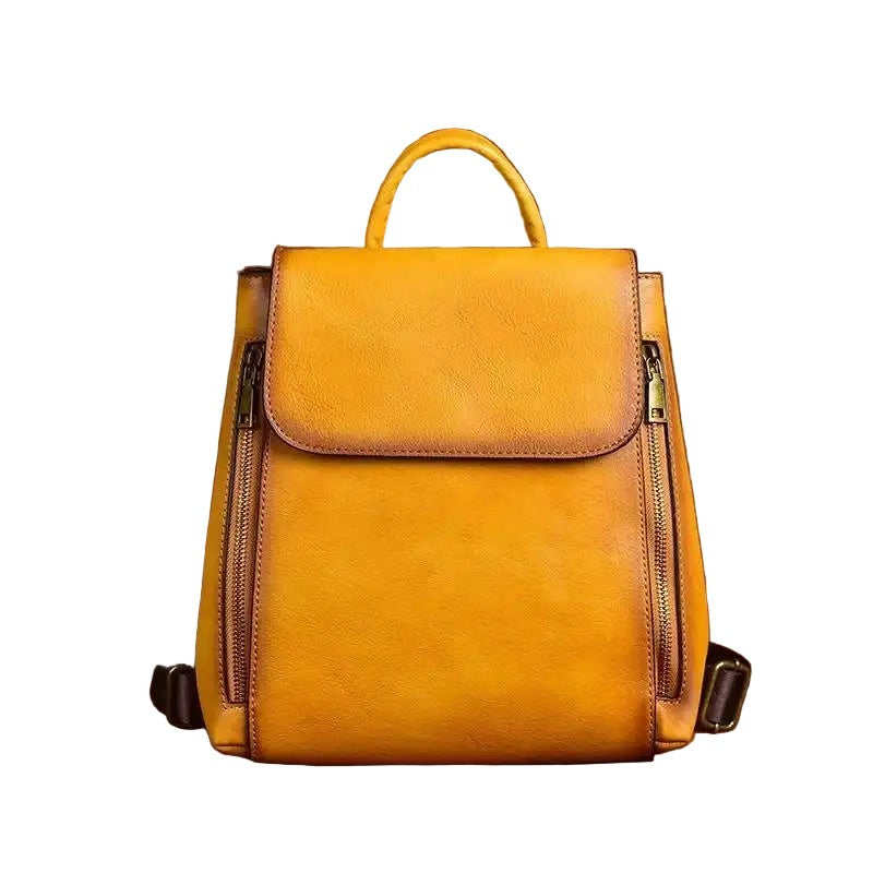 Yellow leather backpack on a white background, front view.