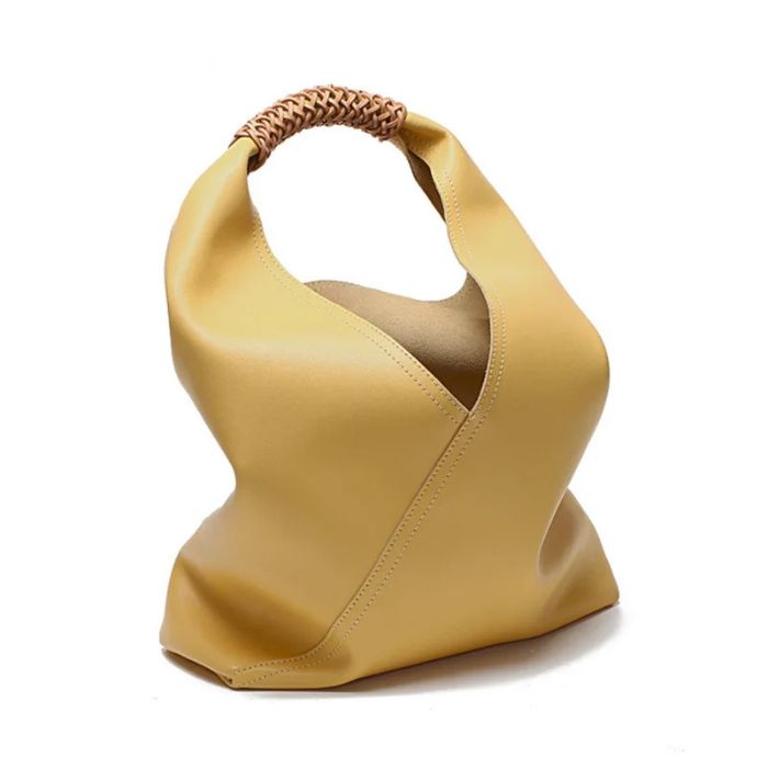 Yellow soft leather bag with unique design and braided handle, front view.